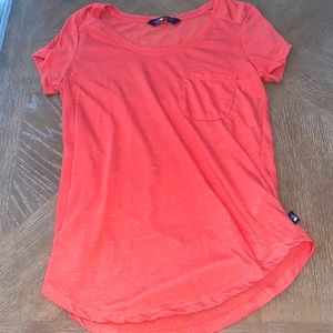 north face pink/orange color shirt with pocket (runs a little big)